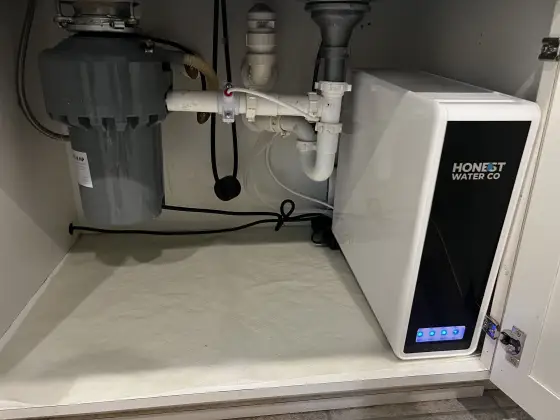 Under-sink reverse osmosis unit installed